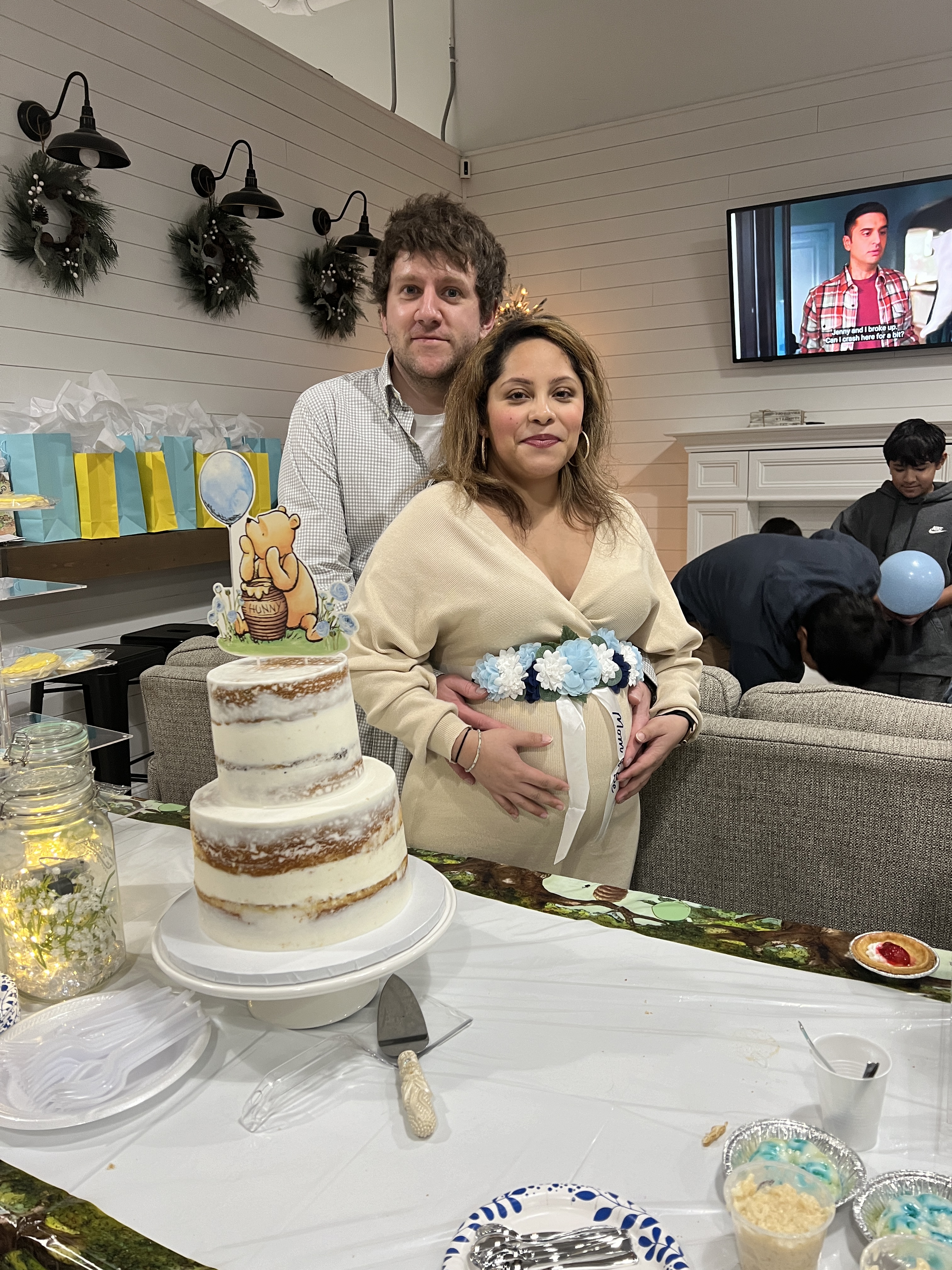 my husband and i at my babyshower