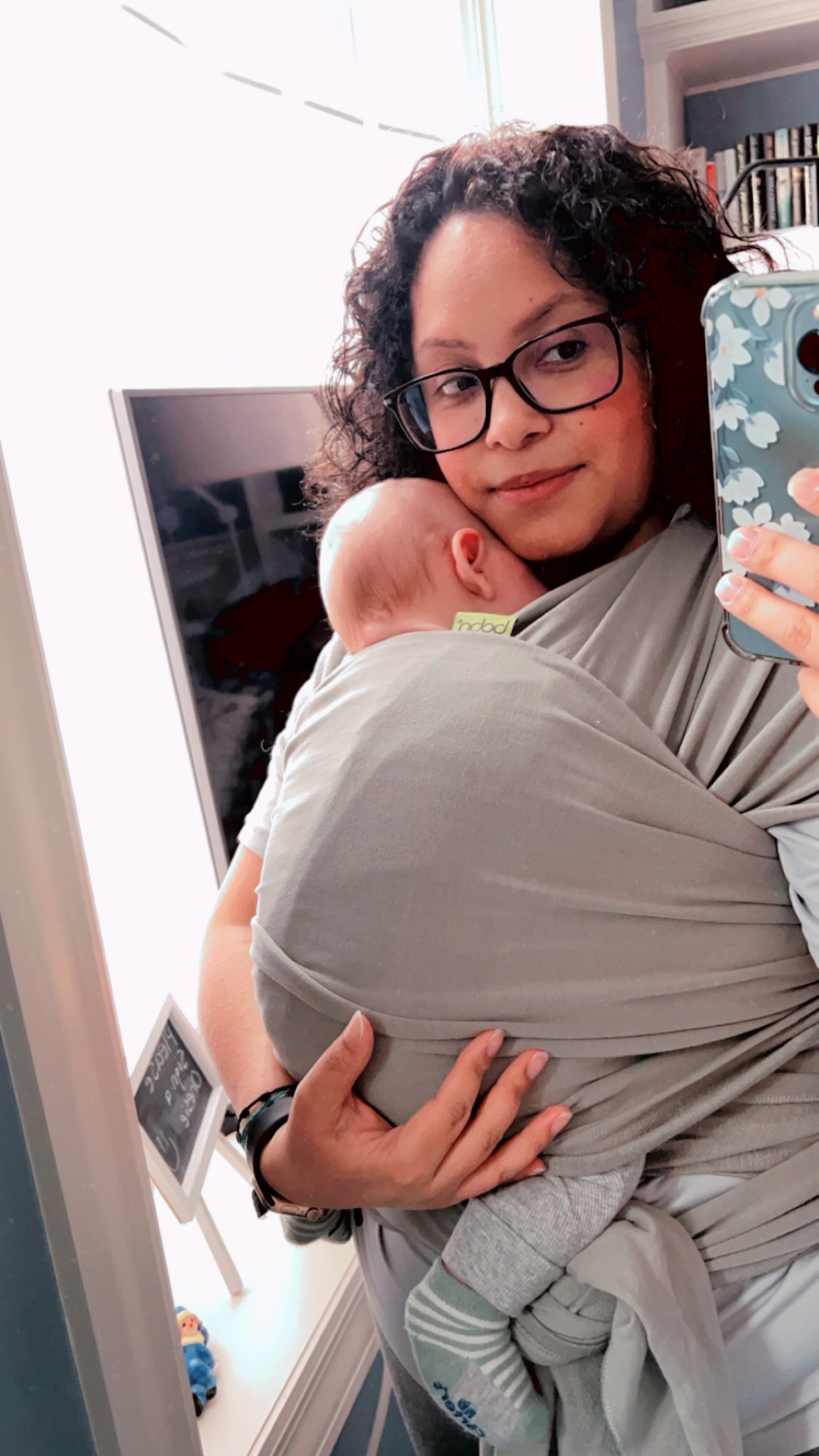 me wearing baby in a cloth carrier